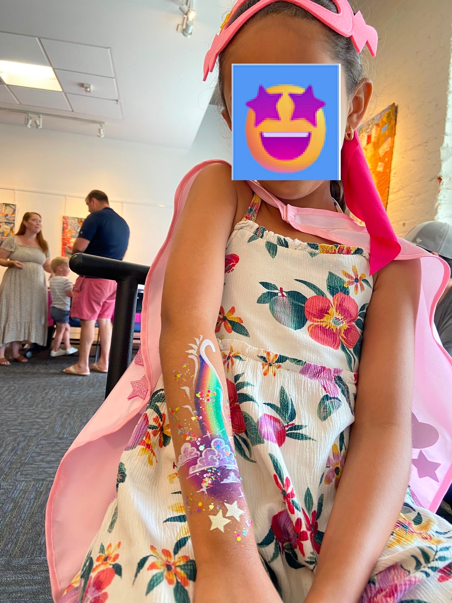 Vibrant rainbow and clouds arm face paint Fuquay-Varina
